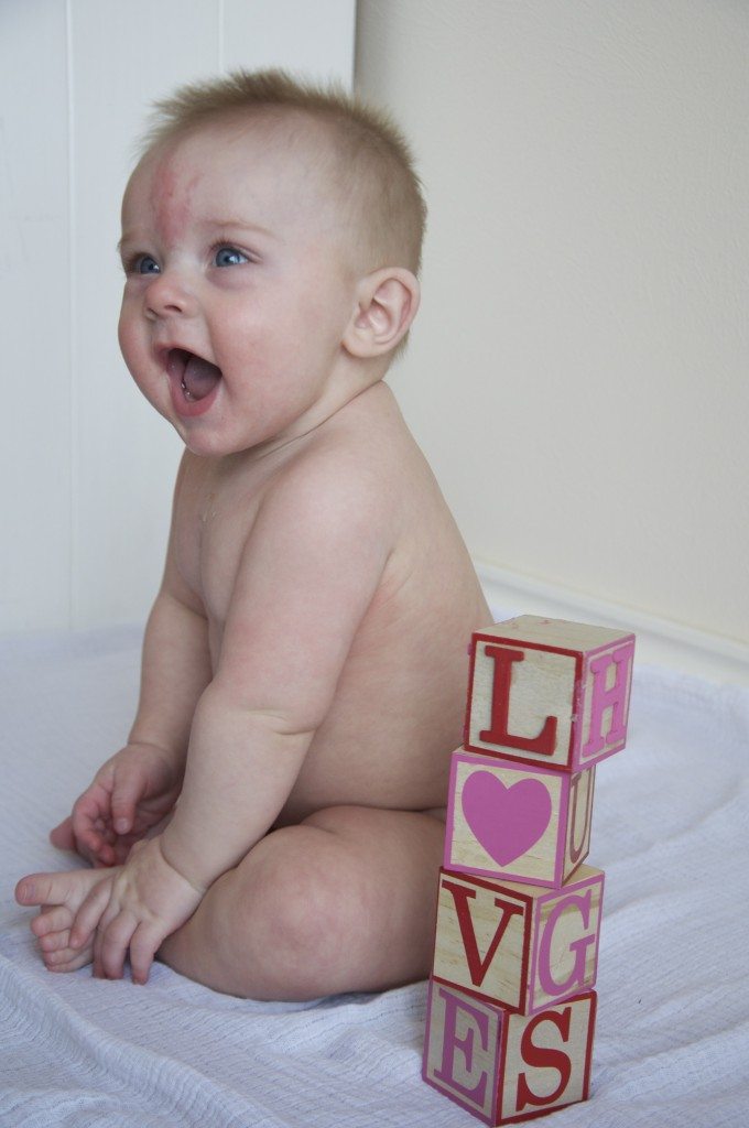 Setting up a darling photo shoot for your kids on Valentine's Day or any other day doesn't have to be hard. I'll show you how to make a fun and simple backdrop with items you may already have at home!