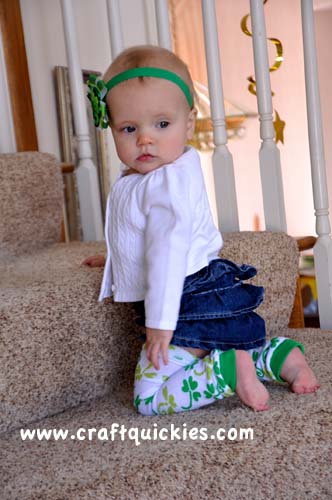 baby wearing baby leg warmers on stairs