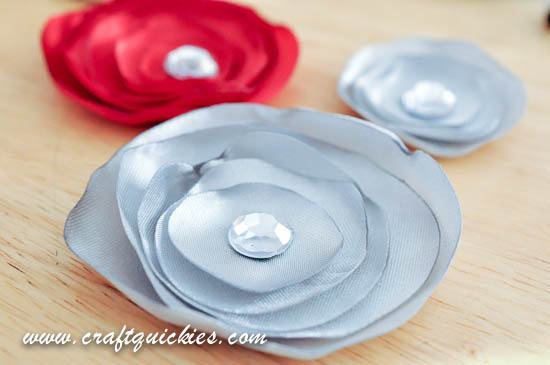 These glamorous silk flowers from Craft Quickies are a cinch to make and can be used in so many ways!  Headbands, hair clips, necklaces, on belts or purses, pinned to a top or sweater, or even sewn to a pillow!