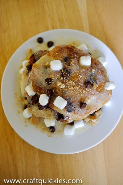 This s'mores pancakes recipe from Craft Quickies is the ultimate decadent brunch item! Graham-cracker buttermilk pancakes with s'mores fixings!
