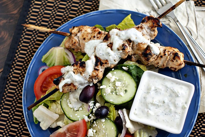 grilling grilled chicken tzatziki salad on blue plate