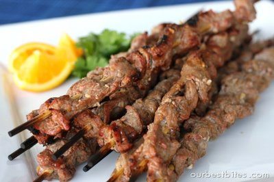 grilling orange thai beef skewers on plate