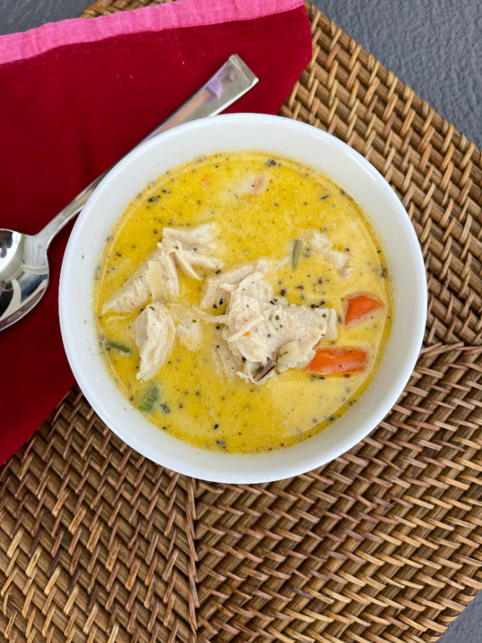 This chicken and wild rice soup recipe is rich, hearty, and sure to impress! Serve it as is or in a bread bowl! YUM!