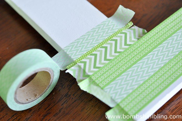 Placing green washi tape on white frame