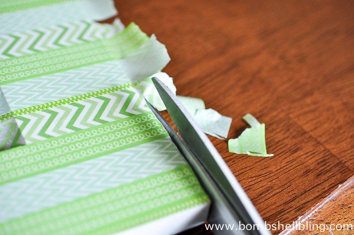 Cutting overlap washi tape from frame using scissors