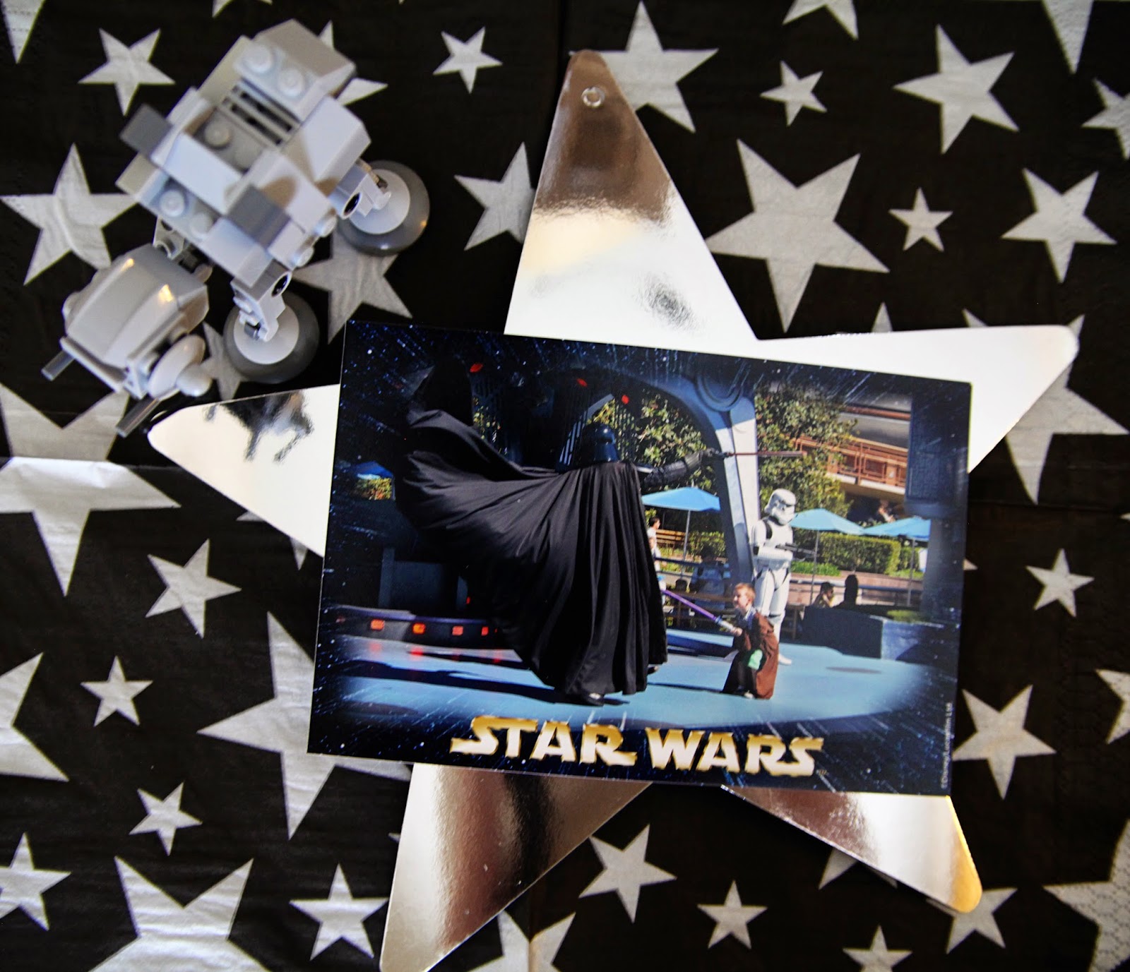 Star Wars Lego table centerpiece photo of boy fighting Vader on silver star