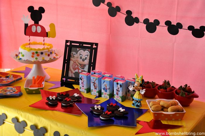 Table with various treats for disney junior birthday party