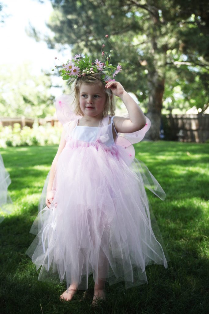 Girl in pink fairy costume at fairy birthday party