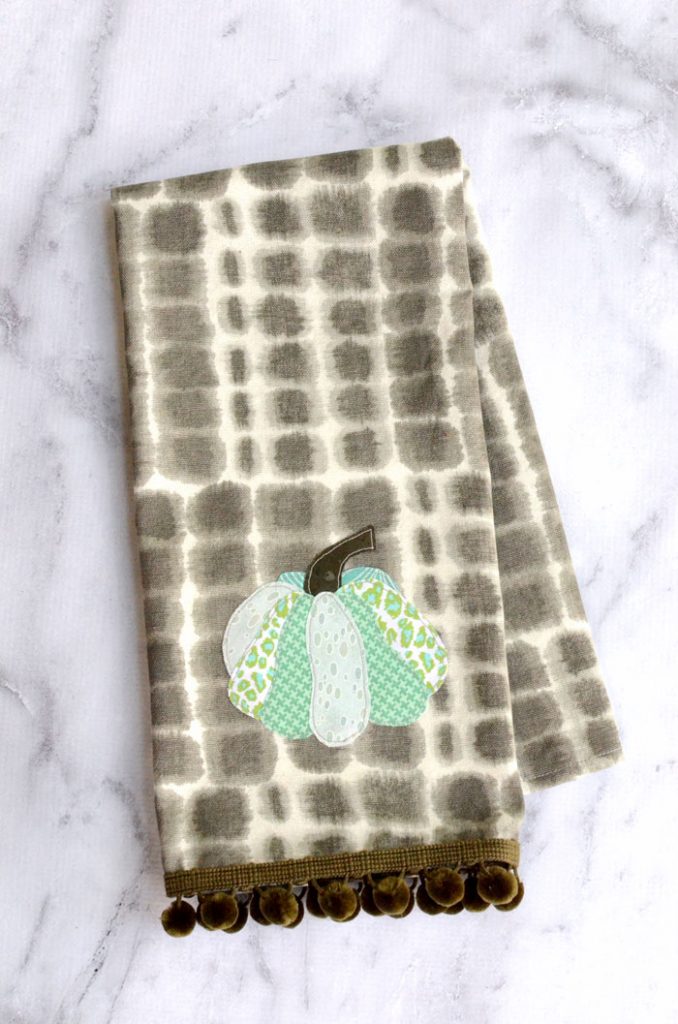 This applique pumpkin tea towel brings a fall vibe to your kitchen.  I’m loving the mix of patterns on the different sections of the pumpkin! 